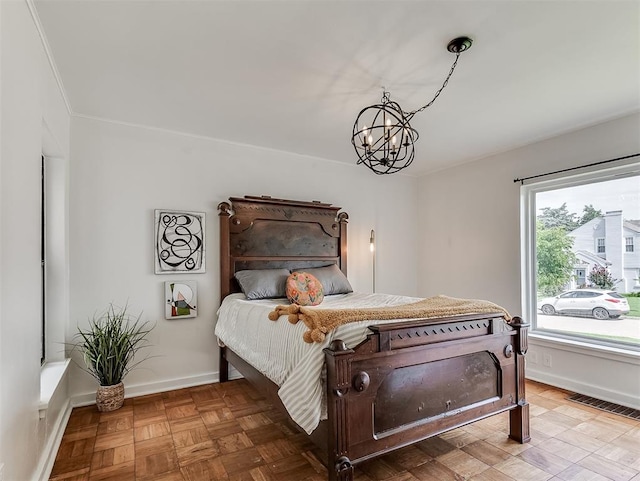 2720 NW 26th St, Oklahoma City, OK 73107 - bedroom featuring a chandelier and baseboards