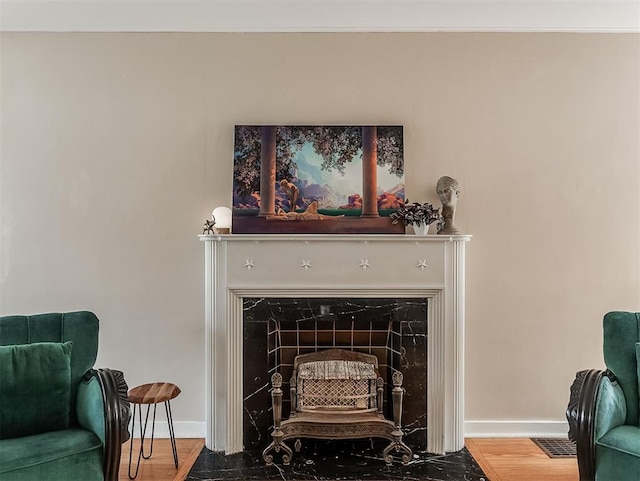 2720 NW 26th St, Oklahoma City, OK 73107 - detailed view of baseboards and a fireplace with flush hearth