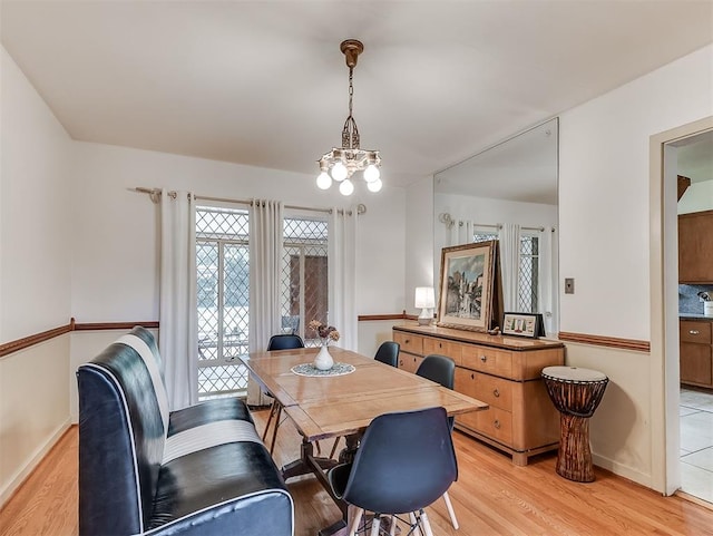 2720 NW 26th St, Oklahoma City, OK 73107 - dining room with light wood-type flooring and a chandelier