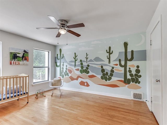 2720 NW 26th St, Oklahoma City, OK 73107 - bedroom with wood finished floors and a ceiling fan
