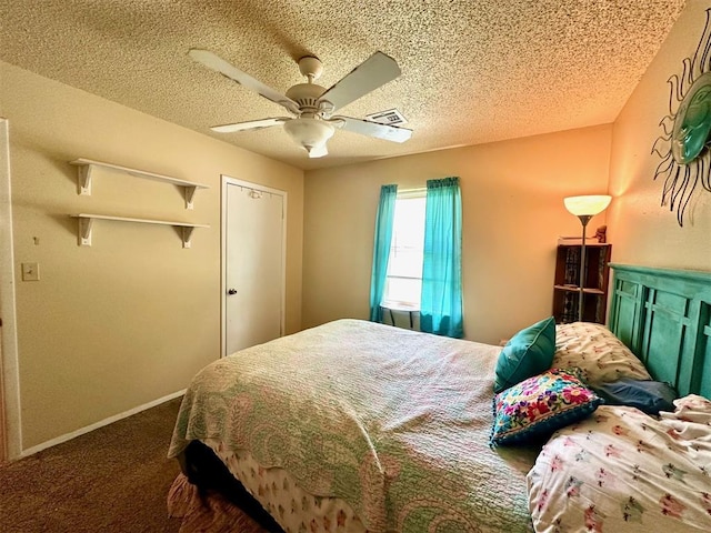 909 N Center St, Shawnee, OK 74801 - bedroom with a textured ceiling, carpet flooring, and a ceiling fan
