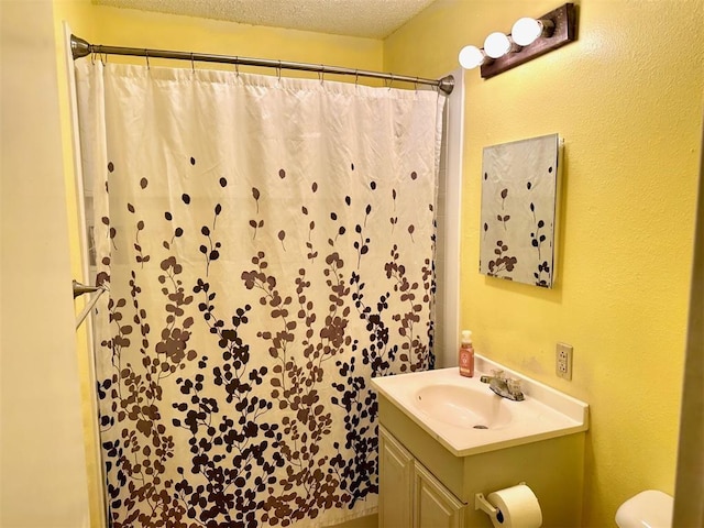 909 N Center St, Shawnee, OK 74801 - bathroom featuring vanity, a textured ceiling, and a shower with shower curtain