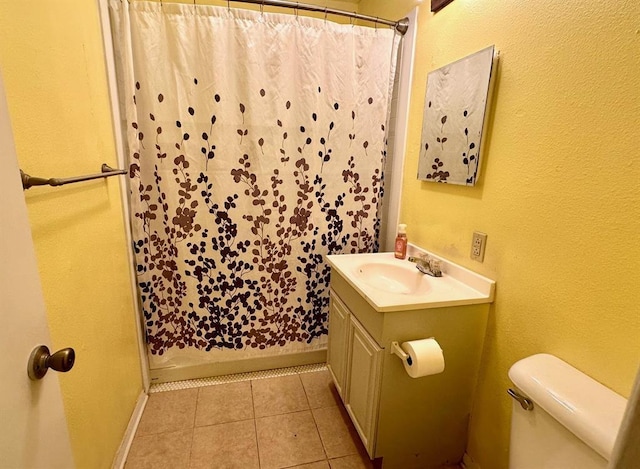 909 N Center St, Shawnee, OK 74801 - bathroom with vanity, a shower with shower curtain, and tile patterned flooring