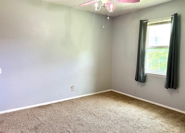 909 N Center St, Shawnee, OK 74801 - carpeted spare room with a ceiling fan, healthy amount of natural light, and a textured ceiling