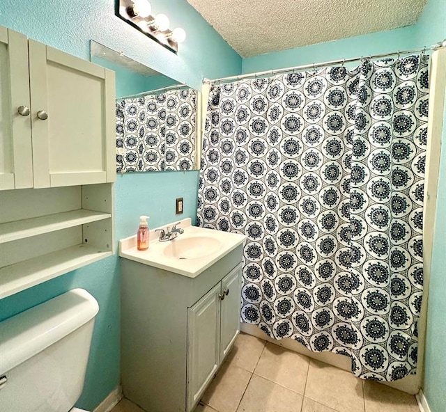909 N Center St, Shawnee, OK 74801 - bathroom with vanity, a textured ceiling, tile patterned floors, and curtained shower