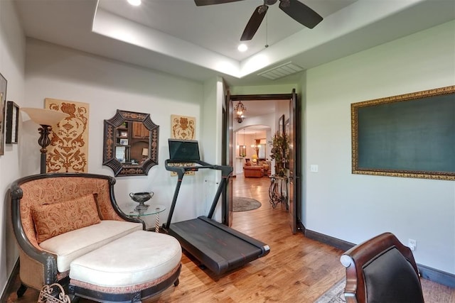 2309 Pinehurst Ct, Shawnee, OK 74801 - sitting room with a raised ceiling, arched walkways, wood finished floors, a ceiling fan, and recessed lighting