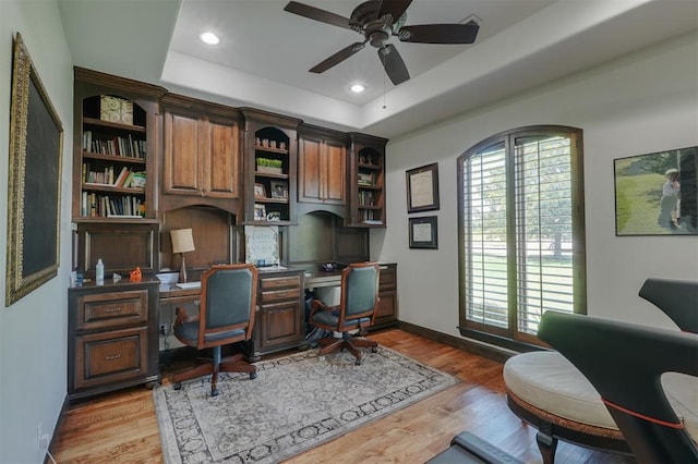 2309 Pinehurst Ct, Shawnee, OK 74801 - office with a ceiling fan, wood finished floors, a tray ceiling, and recessed lighting
