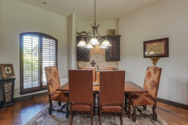 2309 Pinehurst Ct, Shawnee, OK 74801 - dining space featuring a chandelier and wood finished floors