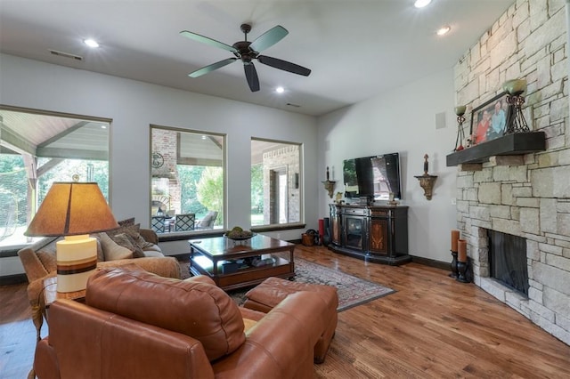 2309 Pinehurst Ct, Shawnee, OK 74801 - living room featuring healthy amount of natural light, ceiling fan, a fireplace, wood finished floors, and recessed lighting