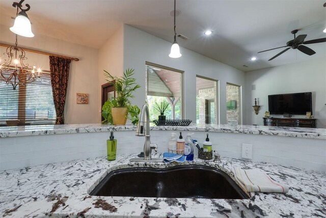 2309 Pinehurst Ct, Shawnee, OK 74801 - kitchen featuring a chandelier, light stone countertops, ceiling fan, decorative light fixtures, and recessed lighting