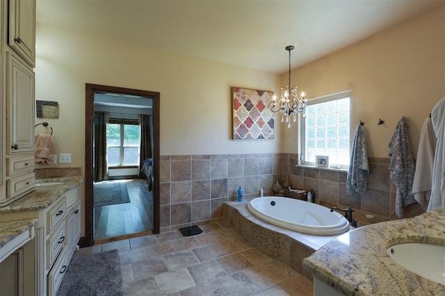 2309 Pinehurst Ct, Shawnee, OK 74801 - full bath with plenty of natural light, vanity, a chandelier, and a bath