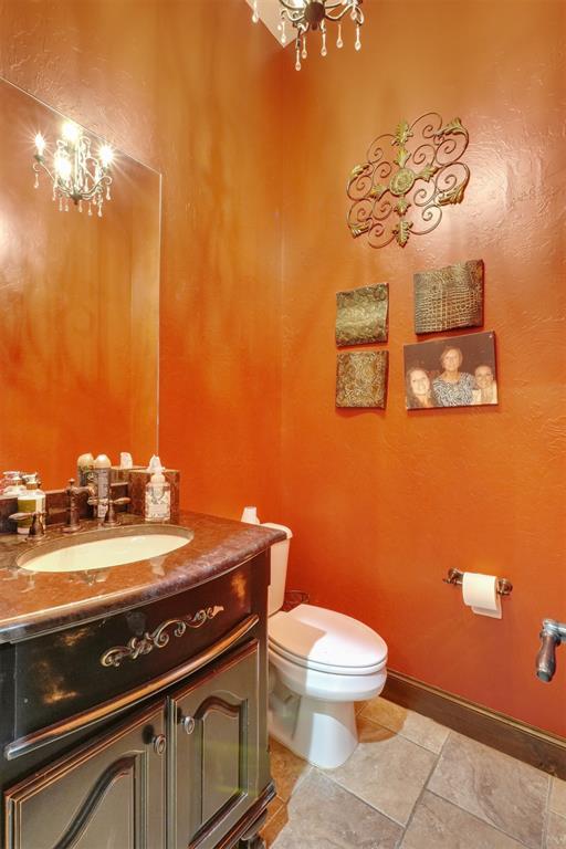 2309 Pinehurst Ct, Shawnee, OK 74801 - half bath featuring vanity and toilet