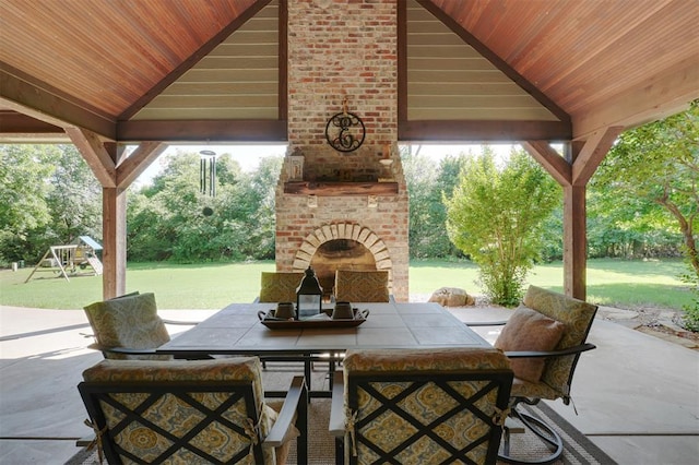 2309 Pinehurst Ct, Shawnee, OK 74801 - view of patio / terrace featuring an outdoor brick fireplace, a gazebo, outdoor dining space, and a playground