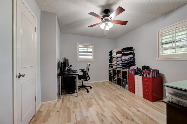 1825 Kings Rd, Edmond, OK 73013 - office with wood finished floors, ceiling fan, and a textured ceiling