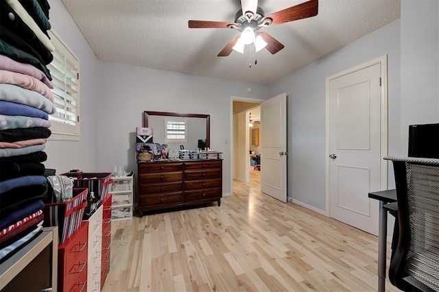1825 Kings Rd, Edmond, OK 73013 - bedroom featuring light wood finished floors and a textured ceiling