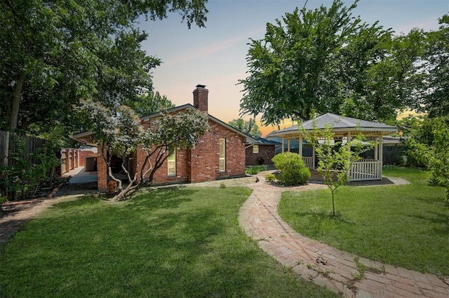 1825 Kings Rd, Edmond, OK 73013 - back of property featuring a chimney and brick siding