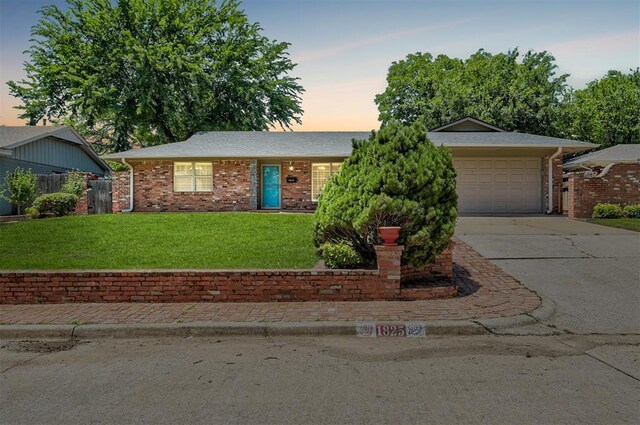1825 Kings Rd, Edmond, OK 73013 - single story home featuring concrete driveway, a garage, and brick siding