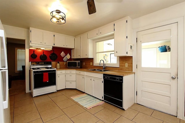 432 S 6th St, Yukon, OK 73099 - kitchen featuring white range with gas cooktop, dishwasher, stainless steel microwave, under cabinet range hood, and light tile patterned flooring