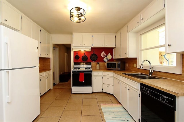 432 S 6th St, Yukon, OK 73099 - kitchen with white appliances, backsplash, white cabinetry, light tile patterned flooring, and light countertops