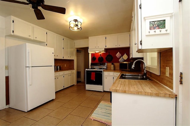 432 S 6th St, Yukon, OK 73099 - kitchen featuring white appliances, under cabinet range hood, light tile patterned flooring, white cabinets, and tasteful backsplash