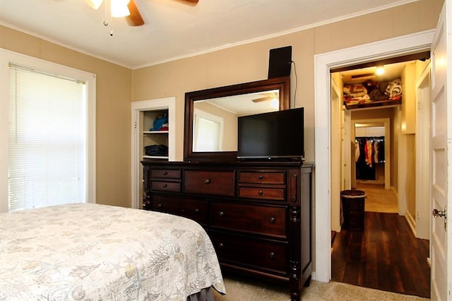432 S 6th St, Yukon, OK 73099 - bedroom with crown molding, a ceiling fan, and wood finished floors
