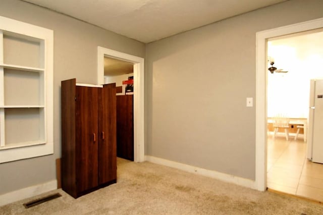 432 S 6th St, Yukon, OK 73099 - unfurnished bedroom with light colored carpet and freestanding refrigerator