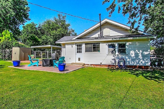432 S 6th St, Yukon, OK 73099 - back of house featuring a patio area, a yard, and a fire pit