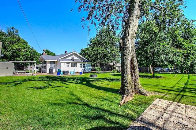 432 S 6th St, Yukon, OK 73099 - view of green lawn with a storage shed