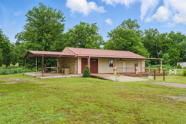5801 N Henney Rd, Coyle, OK 73027 - view of front of home featuring a metal roof and a patio