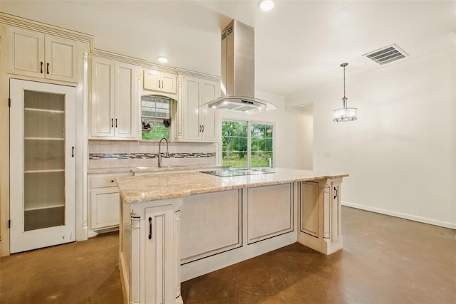 5801 N Henney Rd, Coyle, OK 73027 - kitchen with island range hood, concrete floors, black electric stovetop, decorative backsplash, and a kitchen island