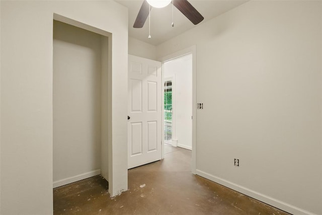 5801 N Henney Rd, Coyle, OK 73027 - unfurnished bedroom featuring concrete floors and a ceiling fan