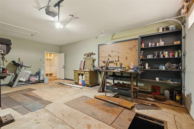 5801 N Henney Rd, Coyle, OK 73027 - garage featuring a garage door opener and a workshop area