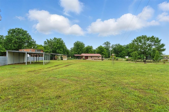 5801 N Henney Rd, Coyle, OK 73027 - view of green lawn with a carport