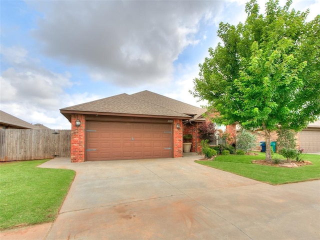 10705 SW 36th St, Yukon, OK 73099 - view of front facade featuring concrete driveway, brick siding, a shingled roof, and an attached garage