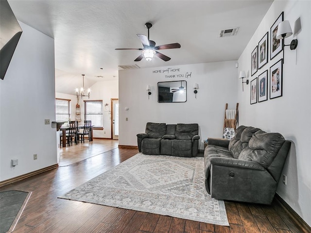 10705 SW 36th St, Yukon, OK 73099 - living area featuring a chandelier, a ceiling fan, and dark wood finished floors