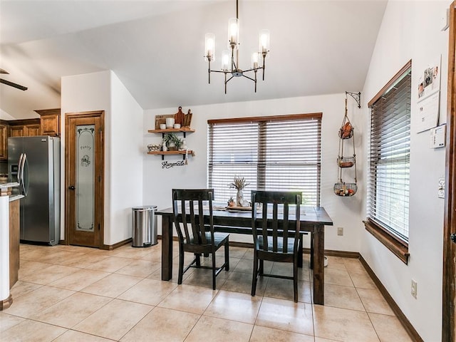 10705 SW 36th St, Yukon, OK 73099 - dining room with a chandelier, lofted ceiling, and light tile patterned flooring