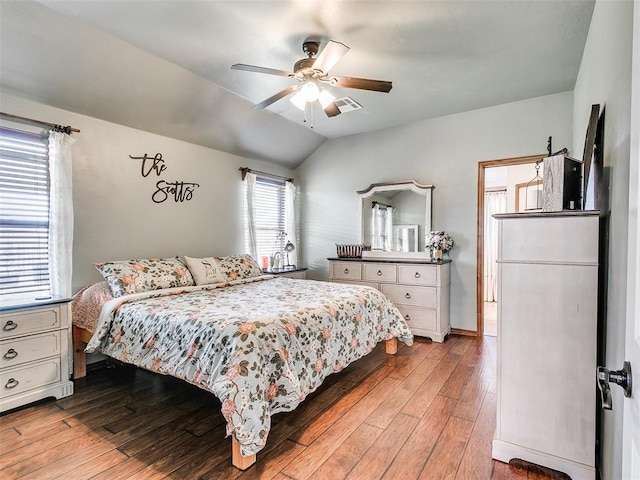 10705 SW 36th St, Yukon, OK 73099 - bedroom with hardwood / wood-style floors, vaulted ceiling, and ceiling fan