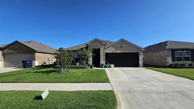 11704 SW 40th St, Mustang, OK 73064 - ranch-style house featuring brick siding, an attached garage, a front yard, and driveway