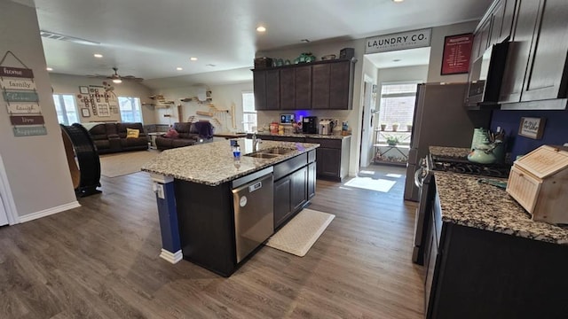 11704 SW 40th St, Mustang, OK 73064 - kitchen with stainless steel appliances, ceiling fan, plenty of natural light, dark wood-style floors, and recessed lighting