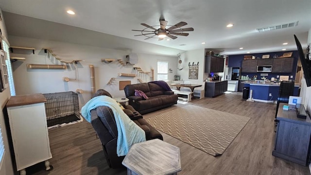 11704 SW 40th St, Mustang, OK 73064 - living area featuring ceiling fan, wood finished floors, stairway, and recessed lighting