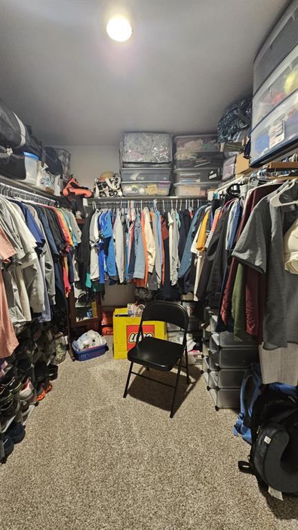 11704 SW 40th St, Mustang, OK 73064 - walk in closet featuring carpet floors
