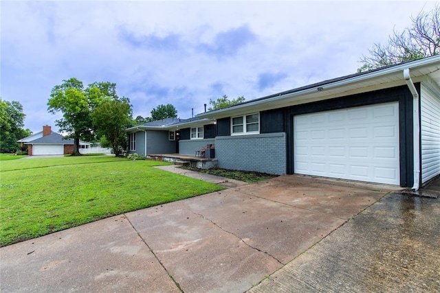 1712 N Pennsylvania Ave, Shawnee, OK 74804 - ranch-style home with a front lawn, concrete driveway, an attached garage, and brick siding