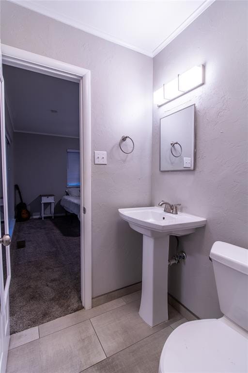 1712 N Pennsylvania Ave, Shawnee, OK 74804 - bathroom featuring ornamental molding and toilet