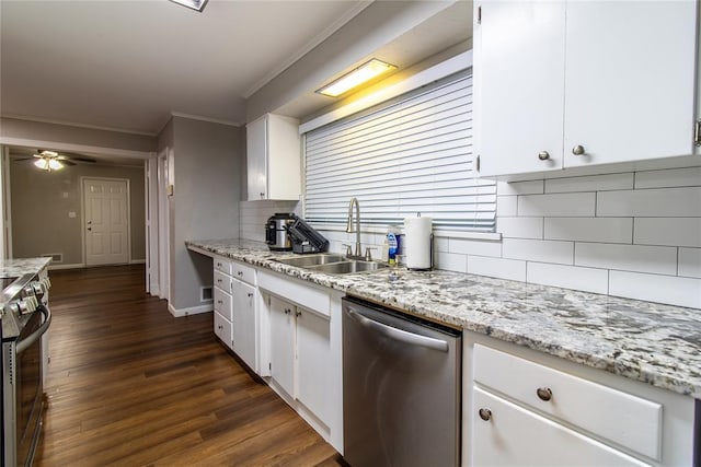 1712 N Pennsylvania Ave, Shawnee, OK 74804 - kitchen featuring appliances with stainless steel finishes, ornamental molding, tasteful backsplash, white cabinets, and dark wood finished floors