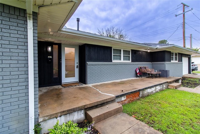 1712 N Pennsylvania Ave, Shawnee, OK 74804 - doorway to property featuring brick siding