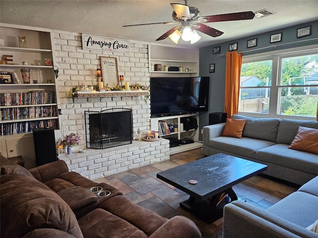 3205 NW 62nd St, Oklahoma City, OK 73112 - living area with a ceiling fan, a brick fireplace, a textured ceiling, and built in features