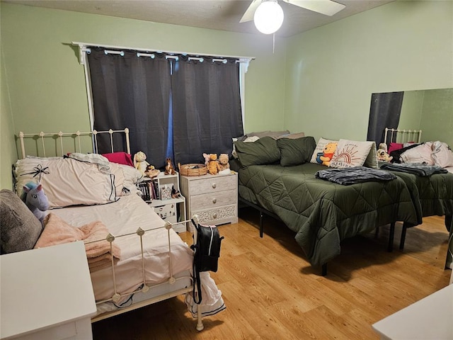 3205 NW 62nd St, Oklahoma City, OK 73112 - bedroom with wood finished floors and ceiling fan