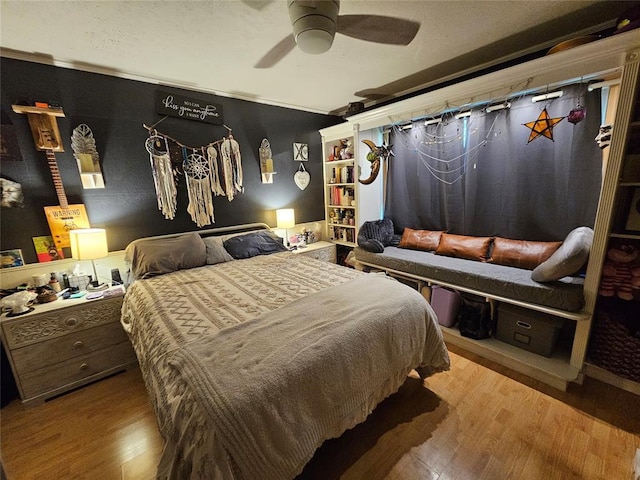 3205 NW 62nd St, Oklahoma City, OK 73112 - bedroom with wood finished floors and ceiling fan