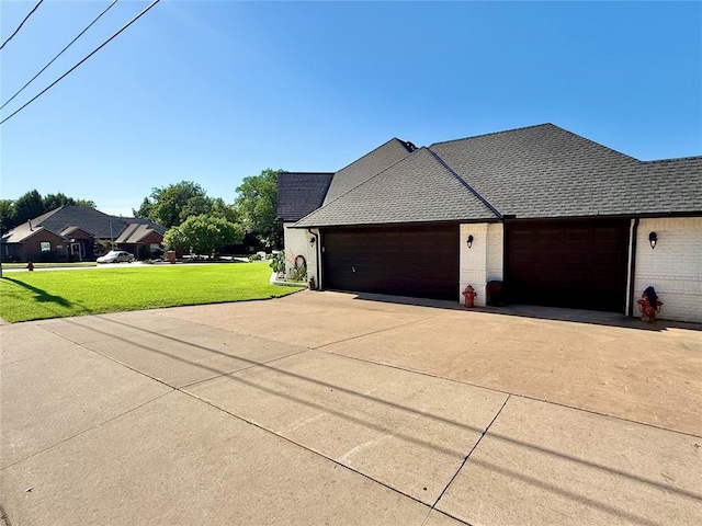 1118 Fernwood Dr, Midwest City, OK 73130 - view of home's exterior with brick siding, concrete driveway, an attached garage, and a yard