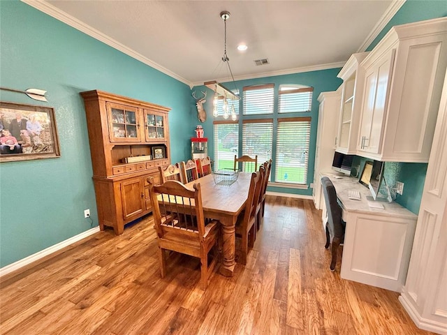 1118 Fernwood Dr, Midwest City, OK 73130 - dining area featuring ornamental molding and light wood-type flooring